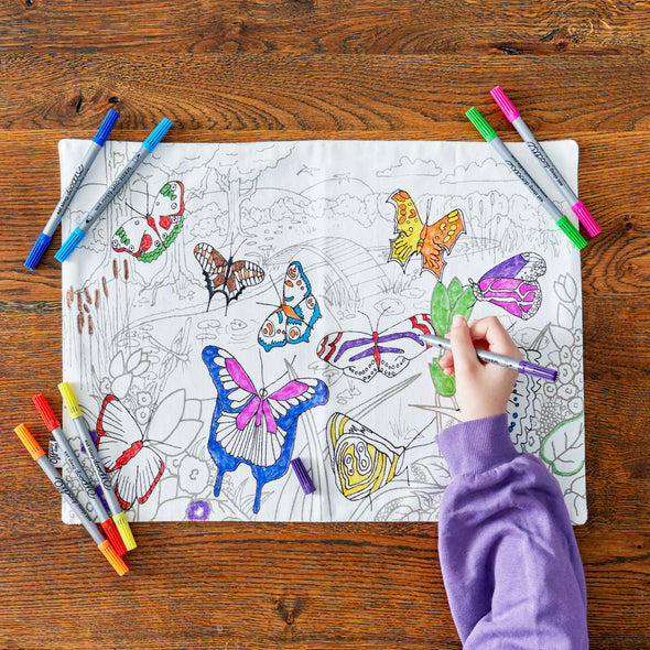 child colouring in butterflies