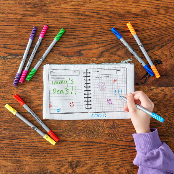 girl customising pencil case