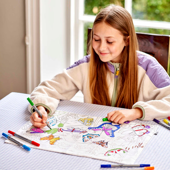 girl colouring in placemat 