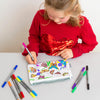 girl in red jumper colouring in