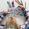 girl in the middle of colouring in a pencil case
