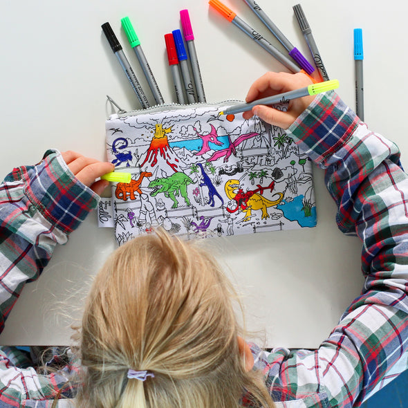 girl in the middle of colouring in a pencil case