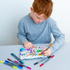 boy in blue jumper colouring in pencil case